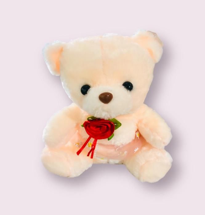 Peluche avec fleur rouge