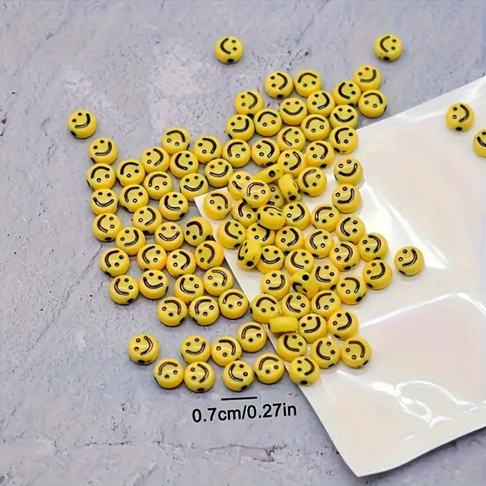 Perles jaunes en forme de smileys pour la fabrication de bracelets pour les enfants